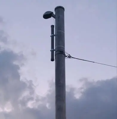 Tall metal pole with streetlight